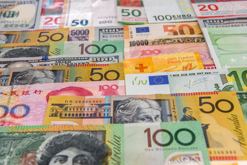 Fototapeta na wymiar Colorful banknotes of different countries as background close up