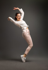 young and beautiful dancer posing in studio