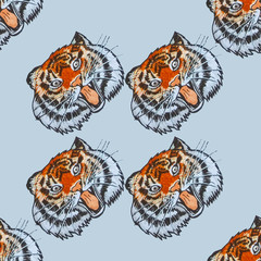 Seamless pattern with the image of the Amur tiger on a blue background.