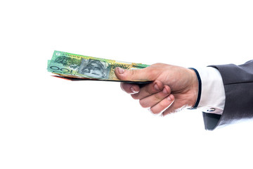 Australian dollars in male hand isolated on white