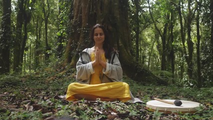 Female shaman in tropical forest
