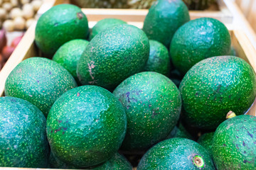 Fresh green avocado fruit  for sell in fresh market. Selective focus.