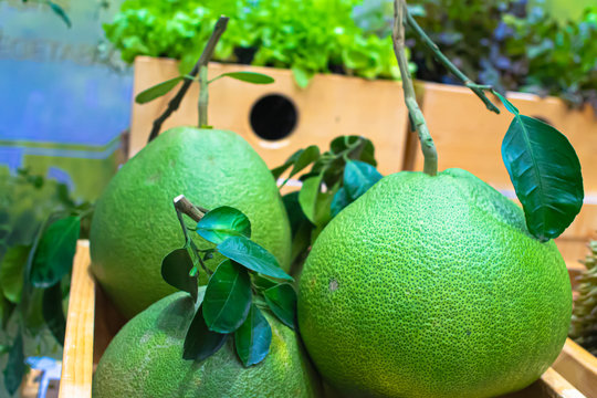 Fresh pamelo fruit  for sell in  fresh market. Giant green Organe. Selective focus with blurred background.