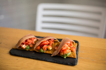 tomato and anchovy appetizer with pesto pasta