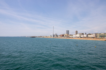 Fototapeta premium Brighton UK, 10th July 2019: The famous beautiful Brighton Beach and Seafront showing the coastline area on a bright sunny day,