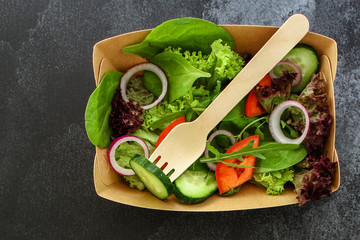 healthy salad (tomato, cucumber, mix leaves, onions and other ingredients) top menu concept. food background. copy space