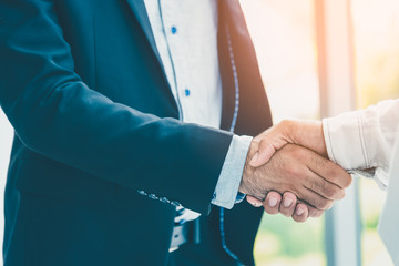 Businessman hand shake after the new project meeting. Two businesman hand shake as business agreement.