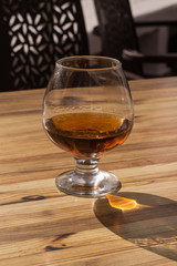 Glass of a drink on the table outdoors