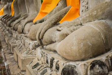 Statues of Buddha sitting in a row at Wat Chai Mongkol in Ayutthaya, Thailand