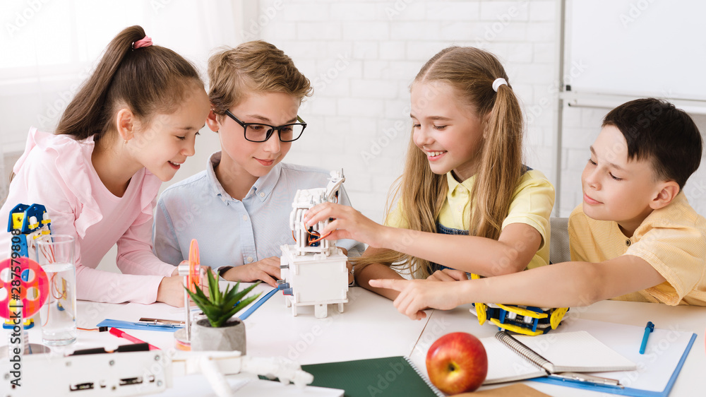 Aufkleber Stem education. Classmates creating modern robots in classroom