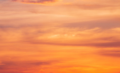 Naklejka na ściany i meble colorful dramatic sky with cloud at sunset.