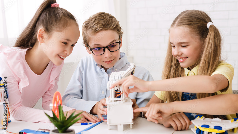 Poster Pupils creating robots together at stem class