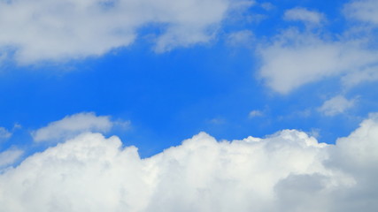The blue sky, the center of the white clouds