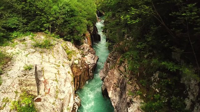 Forward drone shot above a slovenian river flowing in a gorge