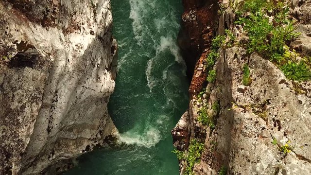 Forward drone shot above a slovenian river flowing in a gorge