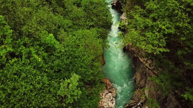 Forward drone shot above a slovenian river flowing in a gorge