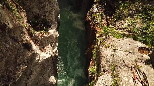 Forward drone shot above a slovenian river flowing in a gorge