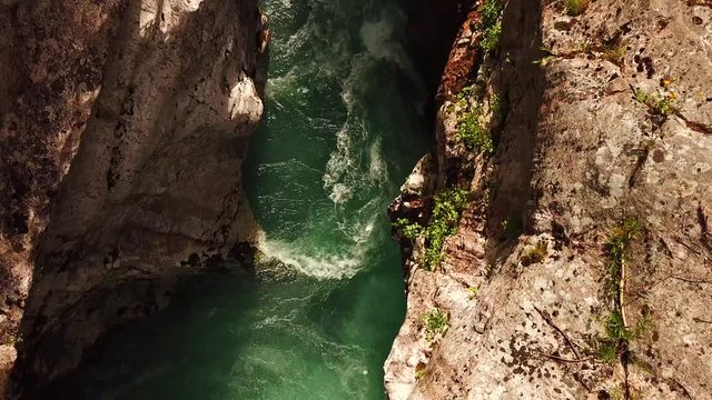 Forward drone shot above a slovenian river flowing in a gorge