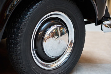 Vintage wheel with protector of retro car, closeup