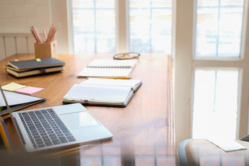 computer notebook stationary on library desk. back to school learning education concept