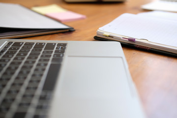computer notebook stationary on library desk. back to school learning education concept