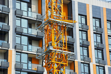 Crane and highrise construction site