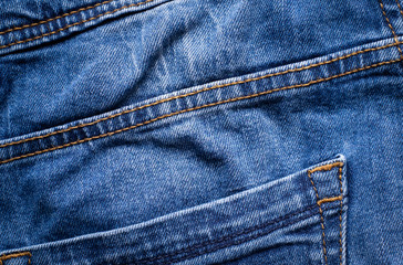 Fototapeta premium Macro, Close-up of texture details of denim blue jeans. Pattern of fabric or textile is abstract background. Concept design fashion and retro stlye.