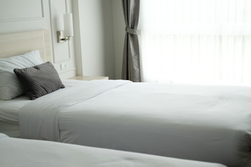 Fototapeta premium bed in in hotel resort. bedroom interior