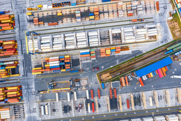 Industrial port area for the shipment of containers of goods and other raw materials, aerial top view.