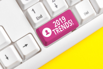 Writing note showing 2019 Trends. Business concept for general direction in which something is developing or changing White pc keyboard with note paper above the white background