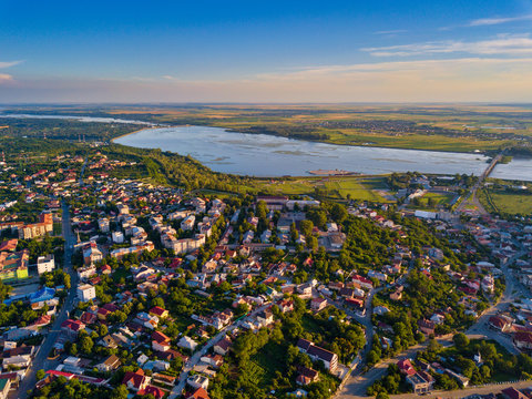 Aerial view of Slatina city and river Olt, Romania. Drone flight over the european city in summer day.