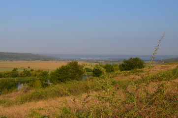 Landscape with river in the morning fog