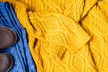 Set of women's autumn, winter clothes - jeans, yellow pullover oversize, suede brown boots. Fashionable clothes for walks, flat lay