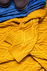 Set of women's autumn, winter clothes - jeans, yellow pullover oversize, suede brown boots. Fashionable clothes for walks, flat lay