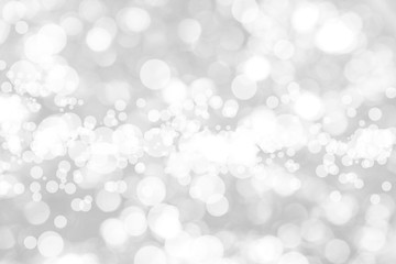 Naklejka na ściany i meble Abstract background with White bokeh on gray background. christmas blurred beautiful shiny Christmas lights.