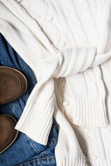 Set of women's autumn, winter clothes - jeans, white pullover oversize, suede brown boots. Fashionable clothes for walks, flat lay