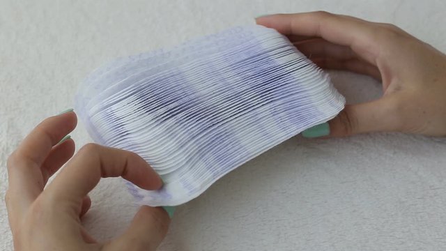 Girl fingering daily sanitary pads concept of cleanliness and hygiene, close-up, menstruation