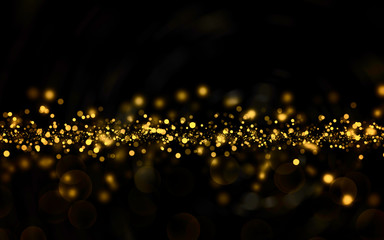 Christmas golden light shine particles bokeh on black club party holiday copy space. background of abstract glitter lights