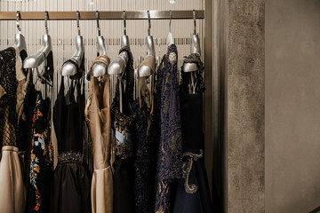 Luxurious evening night out sparkling dresses hanging on the rack. High fashion concept, haute...