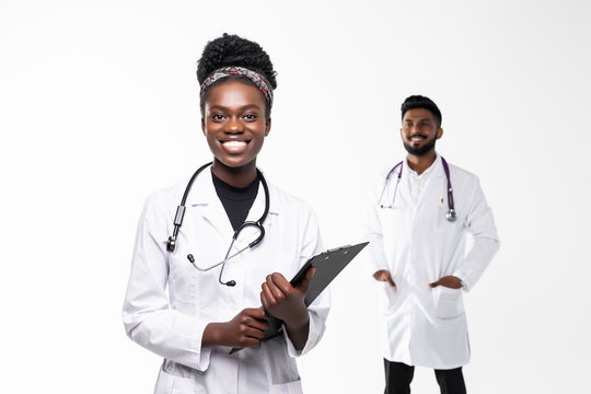 Intellectual healthcare professional afro american doctor with collegue with clipboard isolated on white background