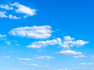 Naklejka na ściany i meble light cumuli clouds in blue sky on sunny day