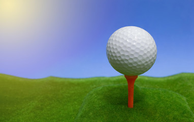 Golf ball on the turf in the blue background