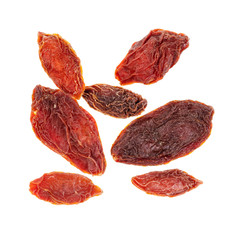 several dried goji berries cut out on white