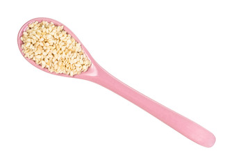 top view of ceramic spoon with white sesame seed