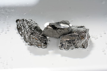 A black rock also called healing stone shungite, which consists mainly of carbon was photographed...