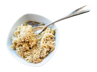 fork in grated kohlrabi salad with sesame cutout