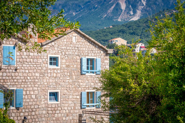 house with blue shutters in Montenegro