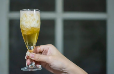 A glass of beer with copyspace on right side