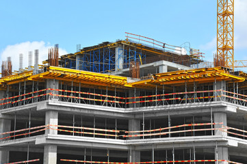 Crane and highrise construction site