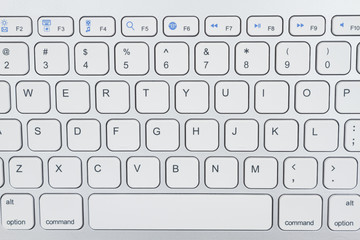 Close-up of a light gray computer keyboard